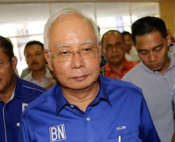 Defeated Malaysian leader, wife barred from leaving country