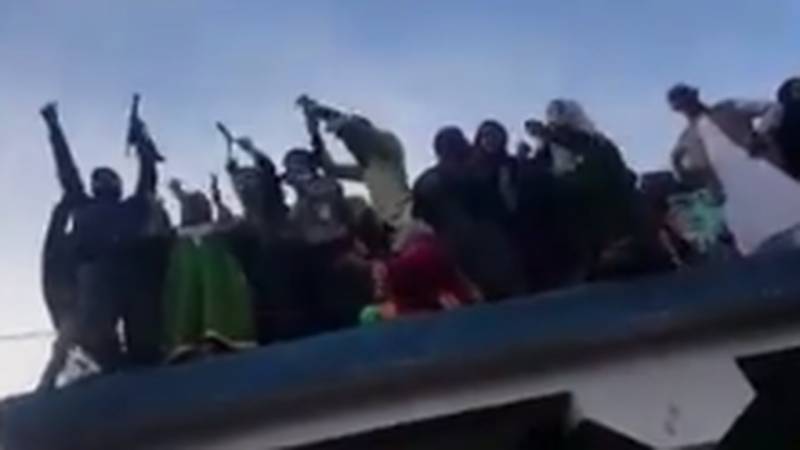 “Slain militant’s mother gives gun salute to son”