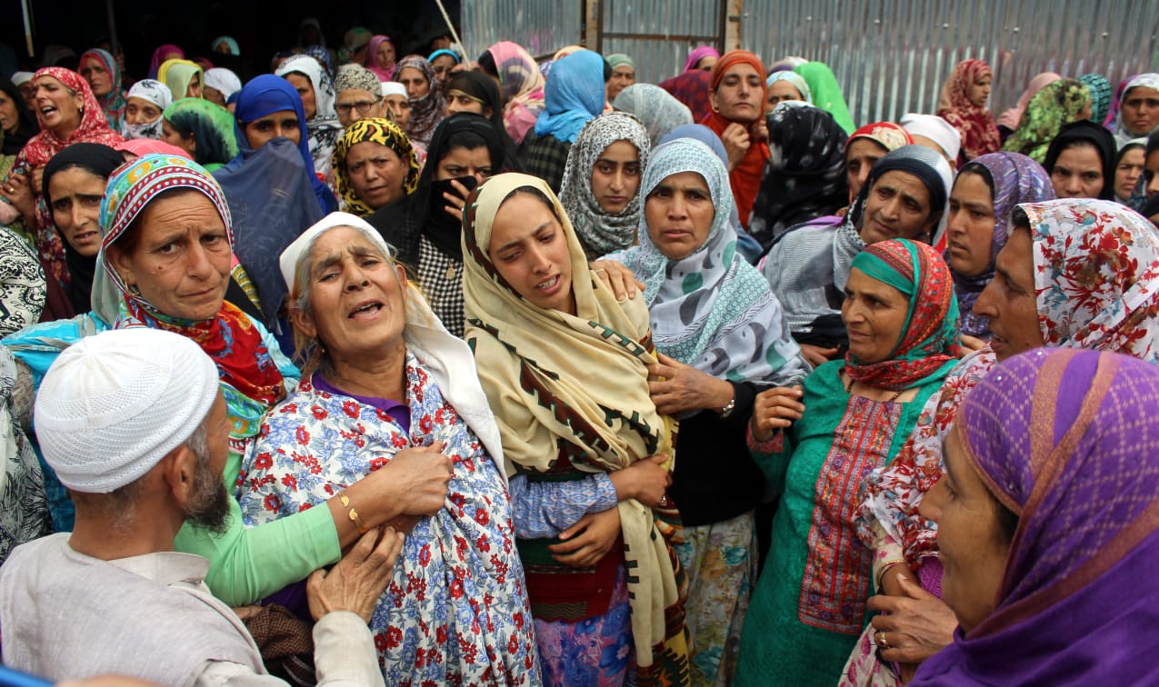 Amid sobs and shrieks, Bomai village receives the coffin