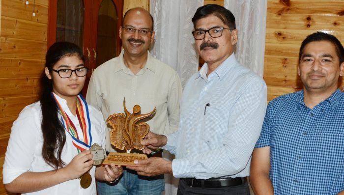 Advisor Vijay Kumar felicitates Silver Medal winner Meenal Gupta