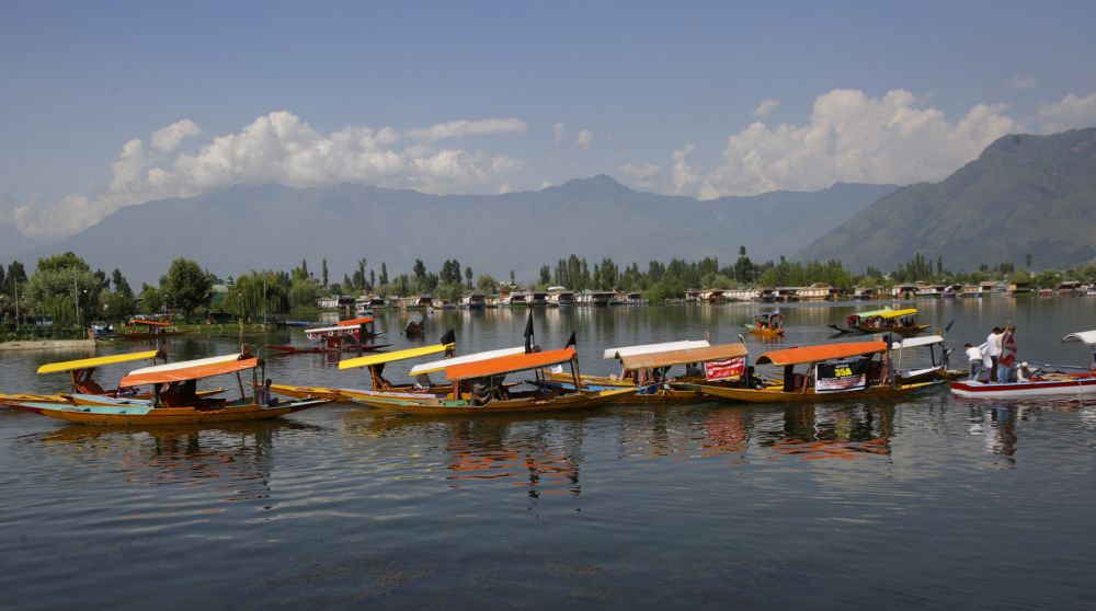 Kashmiri boatmen held a rally on the Dal Lake today to register protest against the legal challenge to the Article 35-A…