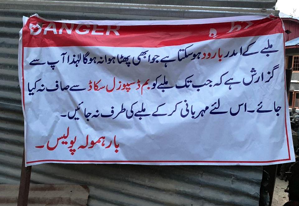 Police erects banners at Kreeri warning people of unxploded shells at encounter site