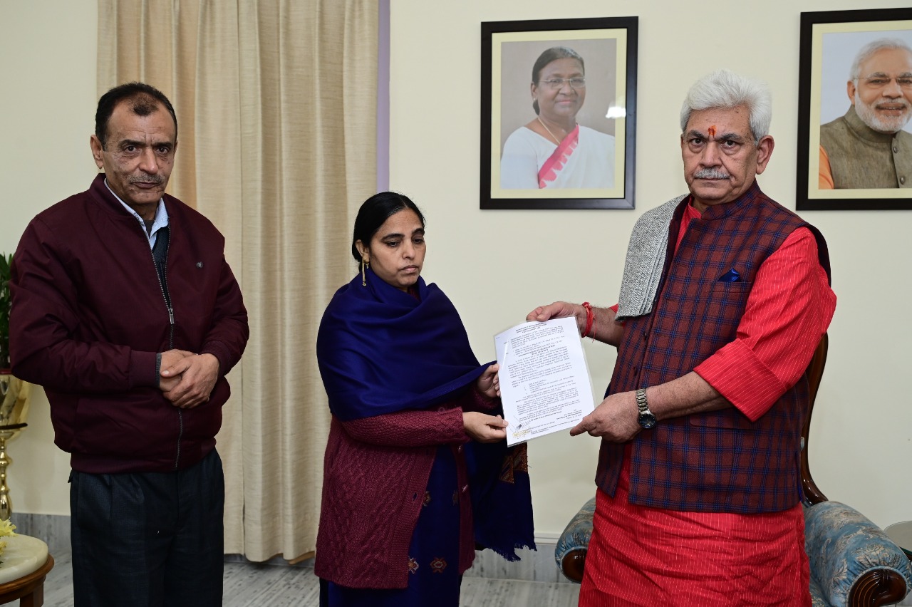 LG hands over appointment letter to wife of Pandit killed in Shopian