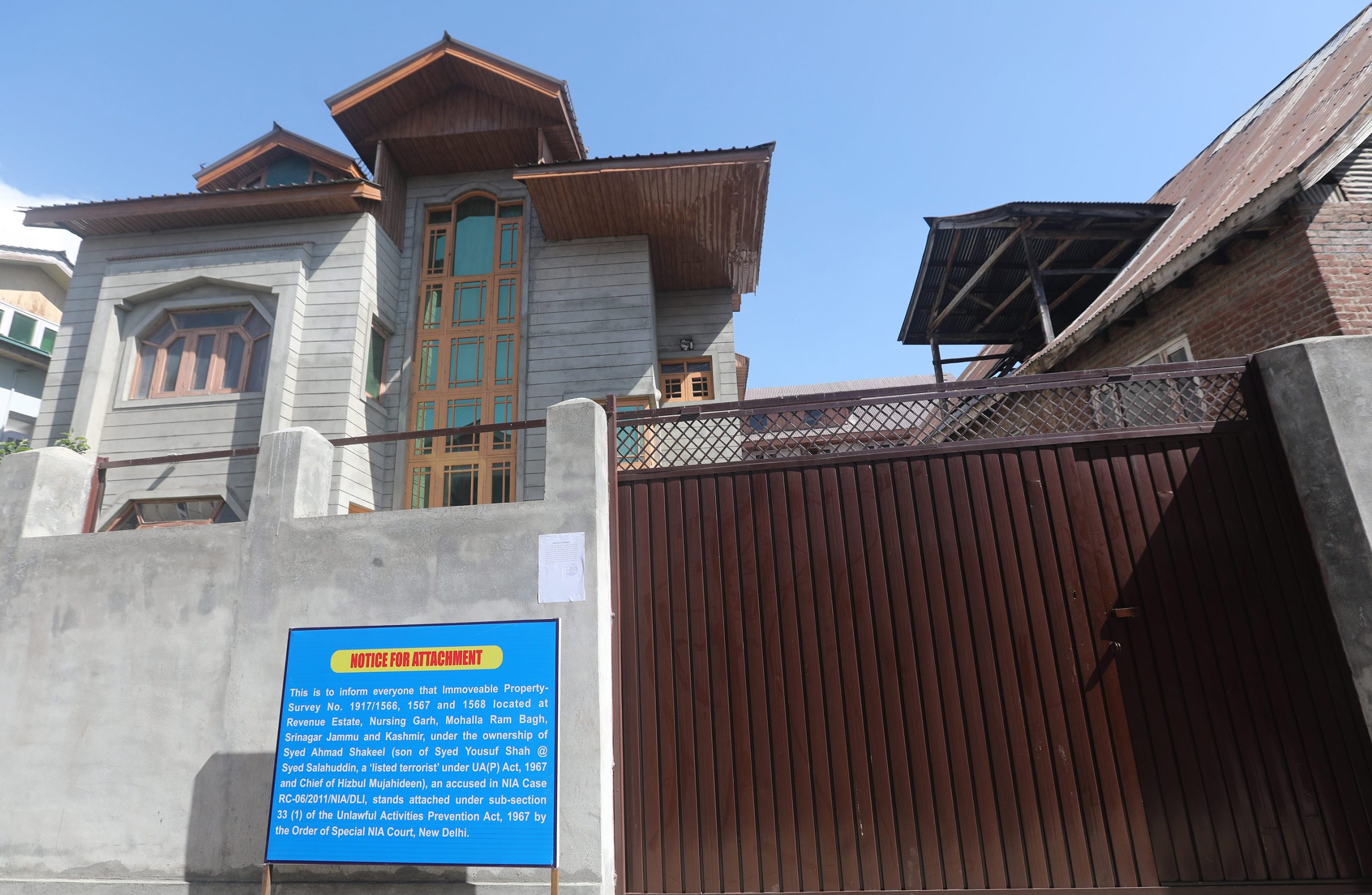 NIA attaches properties of Hizbul Mujahideen chief’s sons in Srinagar, Budgam