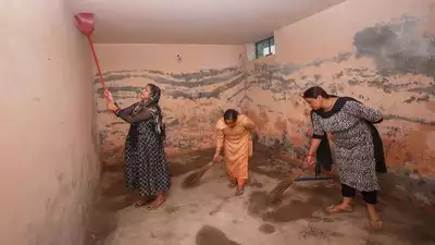 Border residents take to cleaning bunkers in wake of firing, shelling