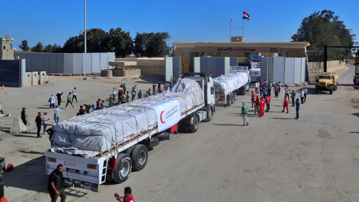 Egypt’s border crossing opens to let a trickle of desperately needed aid into besieged Gaza