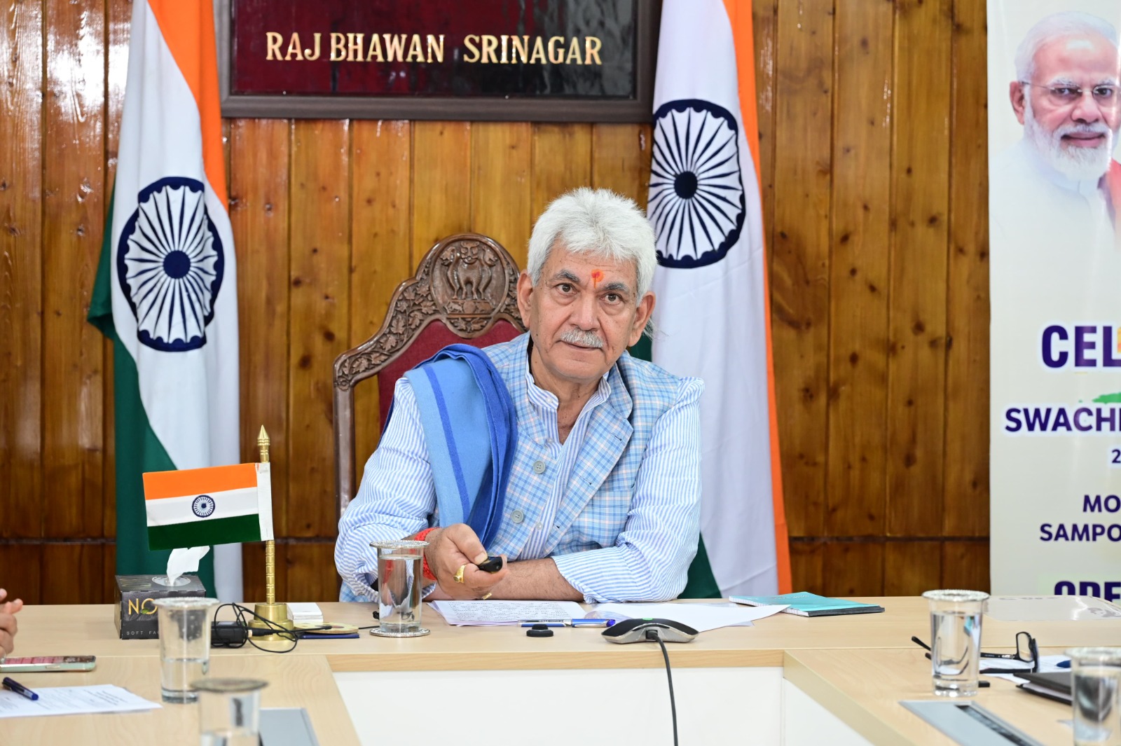 LG hands over land papers to landless beneficiaries under PMAY