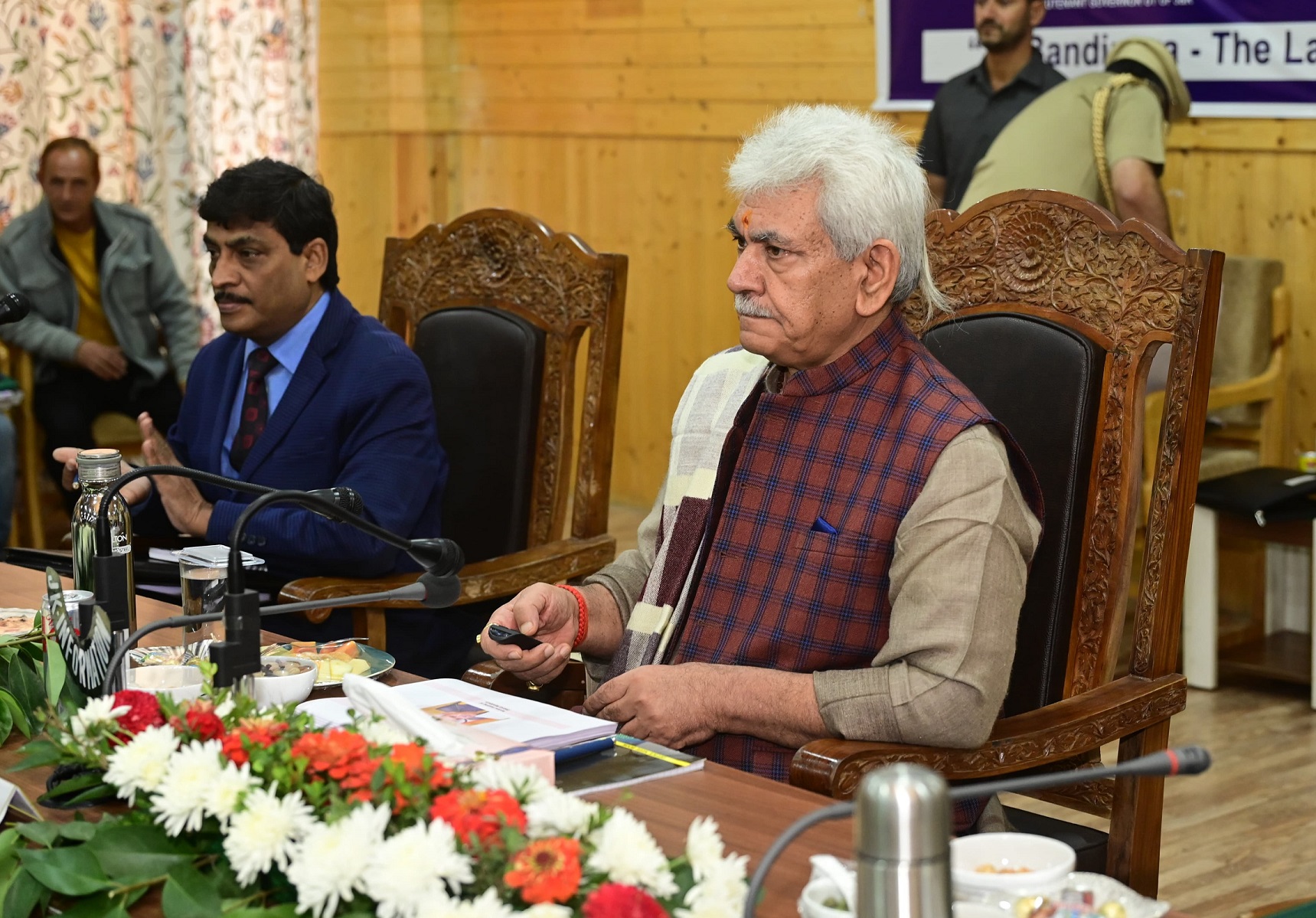 LG hands over land allotment orders to landless beneficiaries of PMAY-G in Bandipora