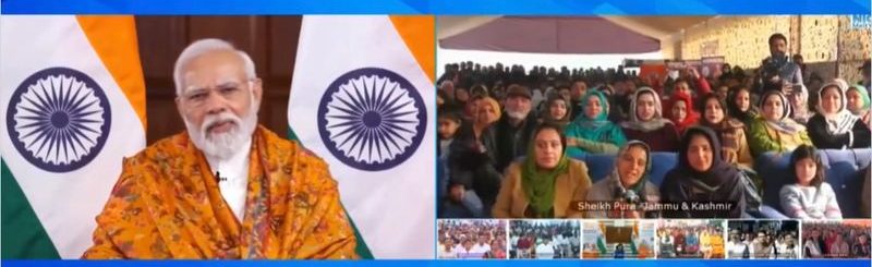 PM interacts with milk vendor, a VBSY beneficiary from Budgam