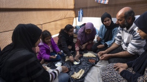 Families in Gaza search desperately for food and water, wait in long lines for aid