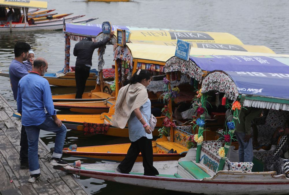 On World Tourism Day, Shikaras on Dal Lake are decorated to welcome visitors