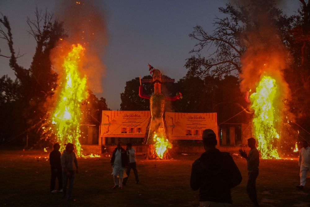 Ravana goes up in flames in a ceremony held at Srinagar on the eve of Dussehra
