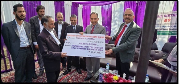 Justice Tashi hands over compensation cheques in MACT cases