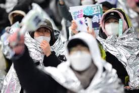 South Korean protesters brave cold to demand Yoon’s ouster as detention deadline looms
