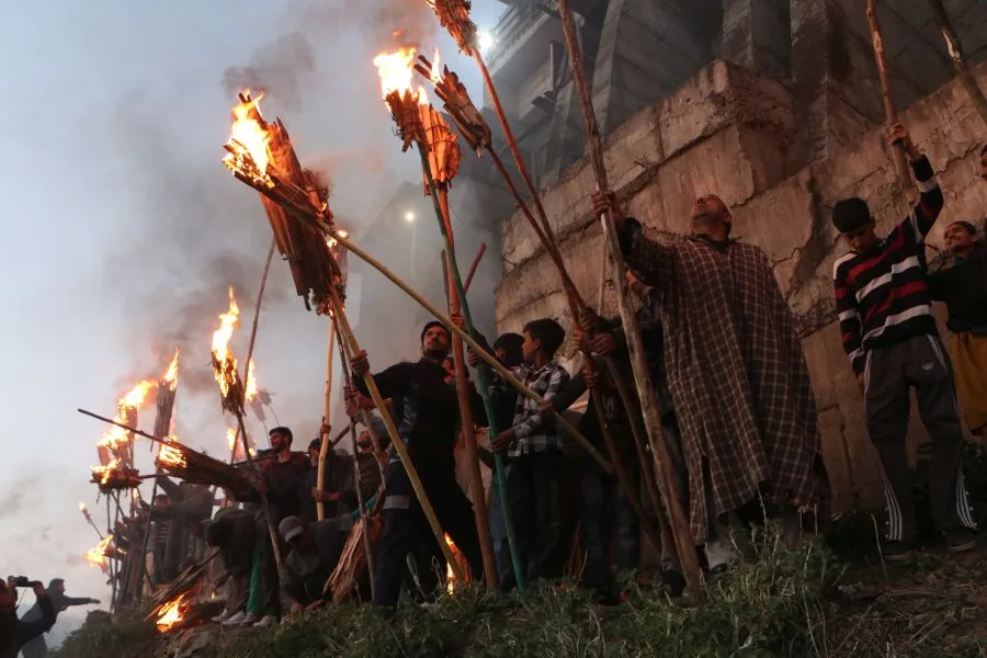 Kashmiris carry on with the centuries-old tradition of marching to the shrine at Aishamuqam with burnt Mashaal