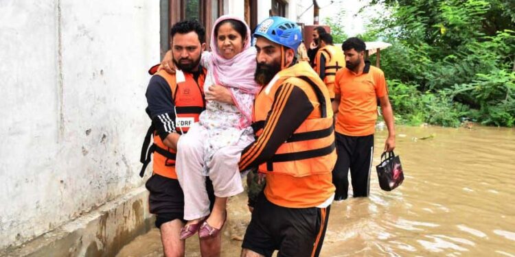 SDRF on the job, rescuing people from flooded areas