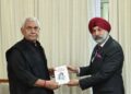 Commodore Dalbir Singh Sodhi presents his books to LG Sinha