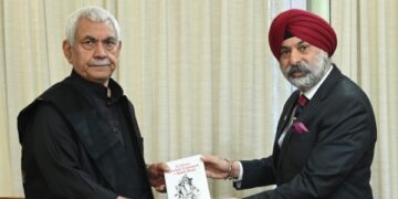 Commodore Dalbir Singh Sodhi presents his books to LG Sinha