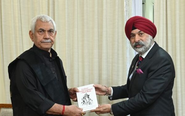 Commodore Dalbir Singh Sodhi presents his books to LG Sinha