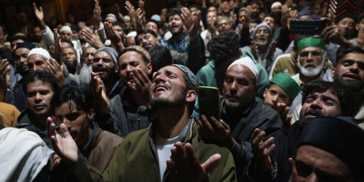 Devotees pray during ‘Shab-e-Qadr’ at the shrine of Dastageer Sahib (Sheikh Syed Abdul Qadir Jeelani RA), in Srinagar