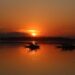 Sunset paints the waters of Dal Lake in golden hues as shikaras rest along the calm waters in Srinagar on Friday.