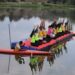 Participants perform yoga on a floating platform during an event marking International Yoga Day at Pokhrabal Lake in Srinagar.