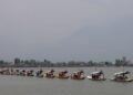 Kashmir Images photographer Farooq Javed captures a scenic view of the Tiranga rally on Dal Lake as the main function was led by LG Manoj Sinha