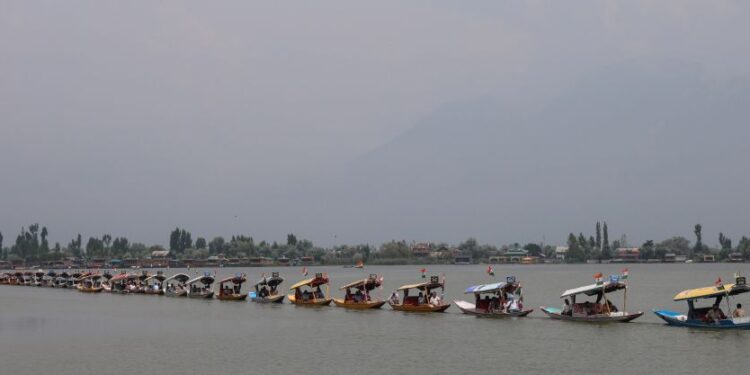 Kashmir Images photographer Farooq Javed captures a scenic view of the Tiranga rally on Dal Lake as the main function was led by LG Manoj Sinha