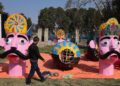 Artisans put the finishing touches on the effigies of Ravana, Meghnad and Kumbhkaran at Srinagar’s Sher-e-Kashmir ground on Monday
