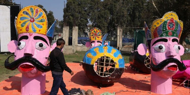 Artisans put the finishing touches on the effigies of Ravana, Meghnad and Kumbhkaran at Srinagar’s Sher-e-Kashmir ground on Monday