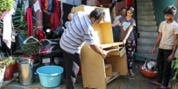 Residents struggle to clear sludge inundating homes after record rainfall floods Jammu localities