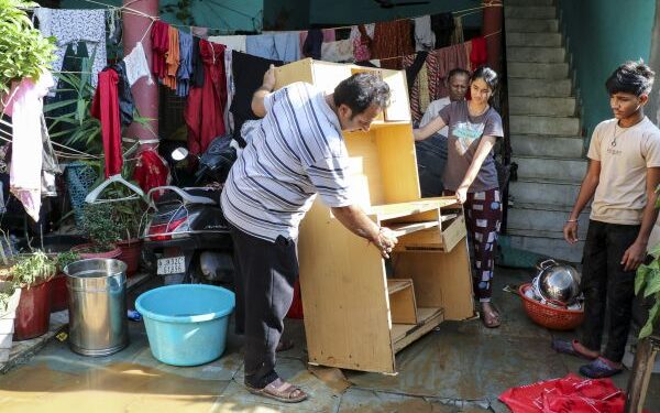 Residents struggle to clear sludge inundating homes after record rainfall floods Jammu localities